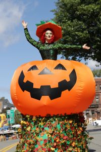 Elaborate Stilt Walking Costume Witch Popping out of a Giant Inflatable Light Up Pumpkin Stilt Walker Halloween Event Entertainment Events Kids Massachusetts Connecticut Rhode Island